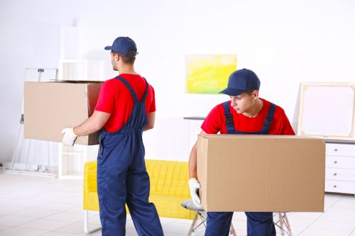 Man And Van Kennington team loading belongings safely with protective equipment