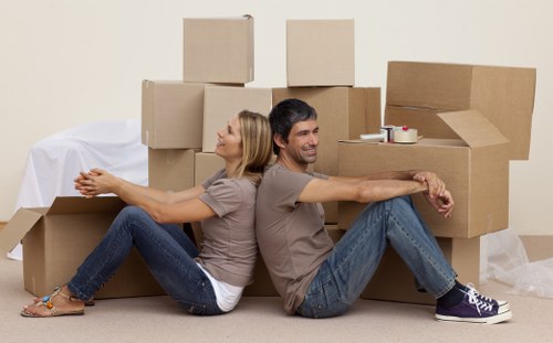 Trained moving staff carrying furniture carefully during a Kennington removal