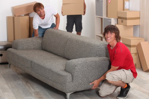 Furniture dismantling and loading during a Kennington business relocation